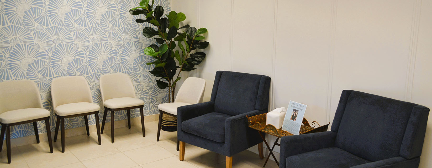 The image shows a modern dental clinic interior with various pieces of equipment, including a dental chair and an X-ray machine.