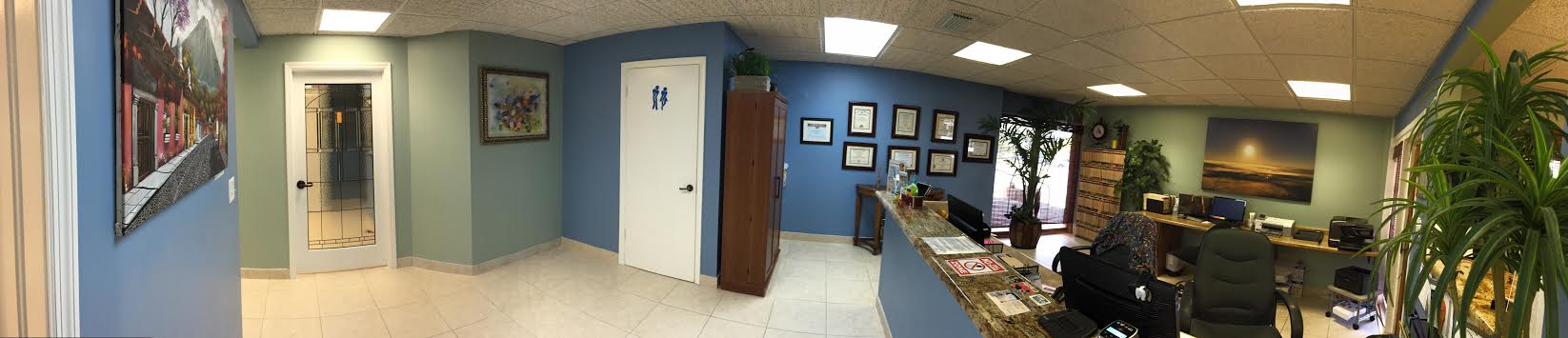 wide picture of the entrance to the office and the front desk