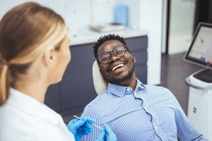 man visiting the dentist for root canal therapy